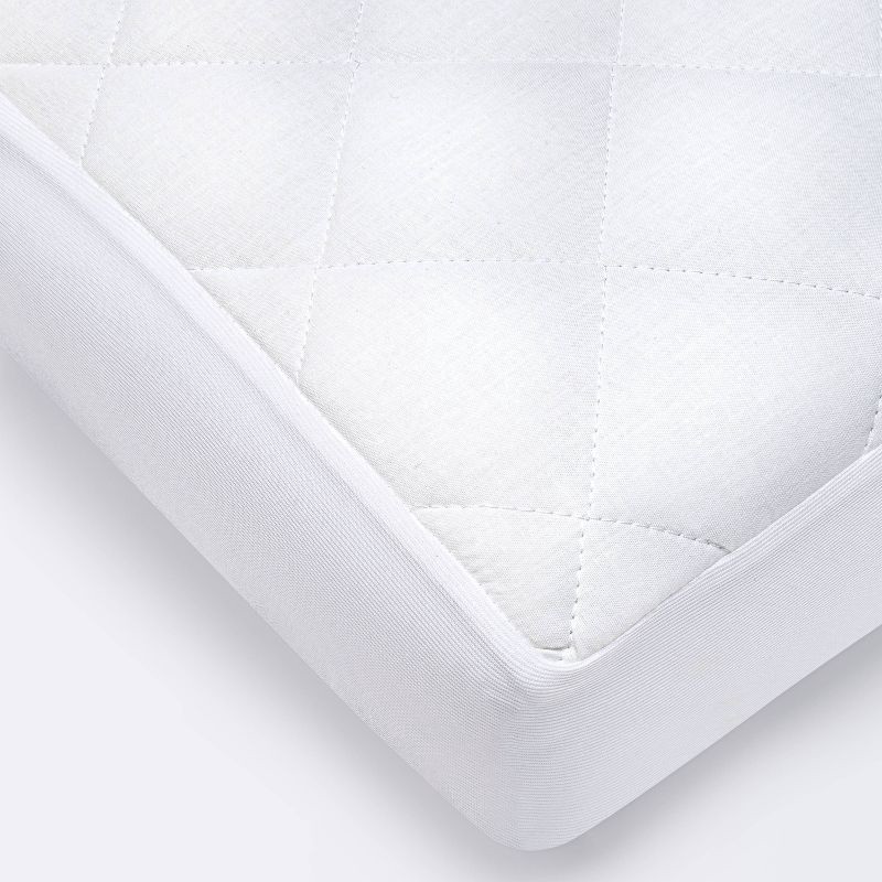 slide 1 of 3, Waterproof Fitted Crib and Toddler Mattress Pad Cover - Cloud Island™ White, 1 ct