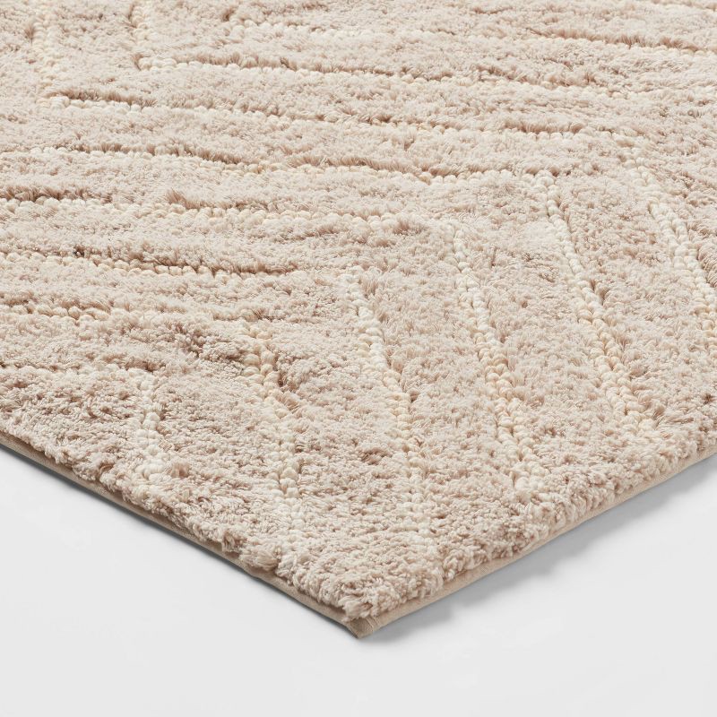 slide 3 of 4, 4'x5'6" Tufted Cotton Chevron Kids' Rug Beige - Pillowfort™, 1 ct