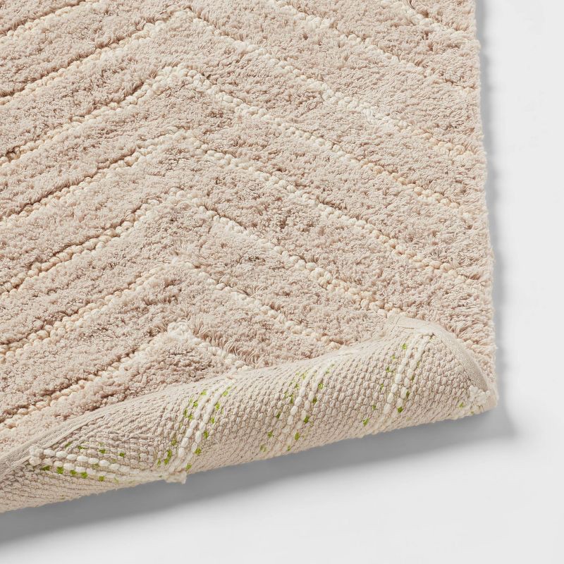 slide 4 of 4, 4'x5'6" Tufted Cotton Chevron Kids' Rug Beige - Pillowfort™, 1 ct