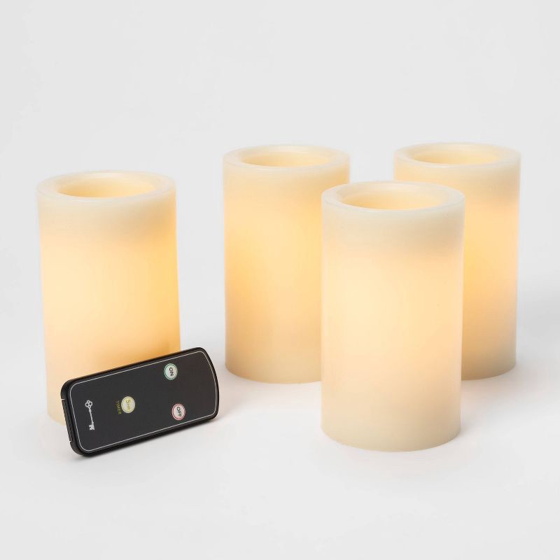 slide 3 of 3, 4pk 5" x 3" LED Flameless Black Wick Candle Cream - Threshold™: Wax Pillar Decor, Battery Operated, Safe Ambiance, 4 ct