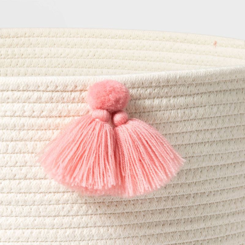 slide 3 of 5, Large Coiled Rope Kids' Basket with Tassels Natural/Rose Pink - Pillowfort™, 1 ct