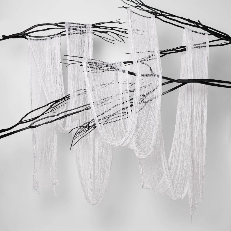 slide 3 of 3, 36' Black Light Responsive Jumbo Eerie Fabric White Halloween Prop - Hyde & EEK! Boutique™: Polyester Mesh, Indoor/Outdoor Use, 1 ct
