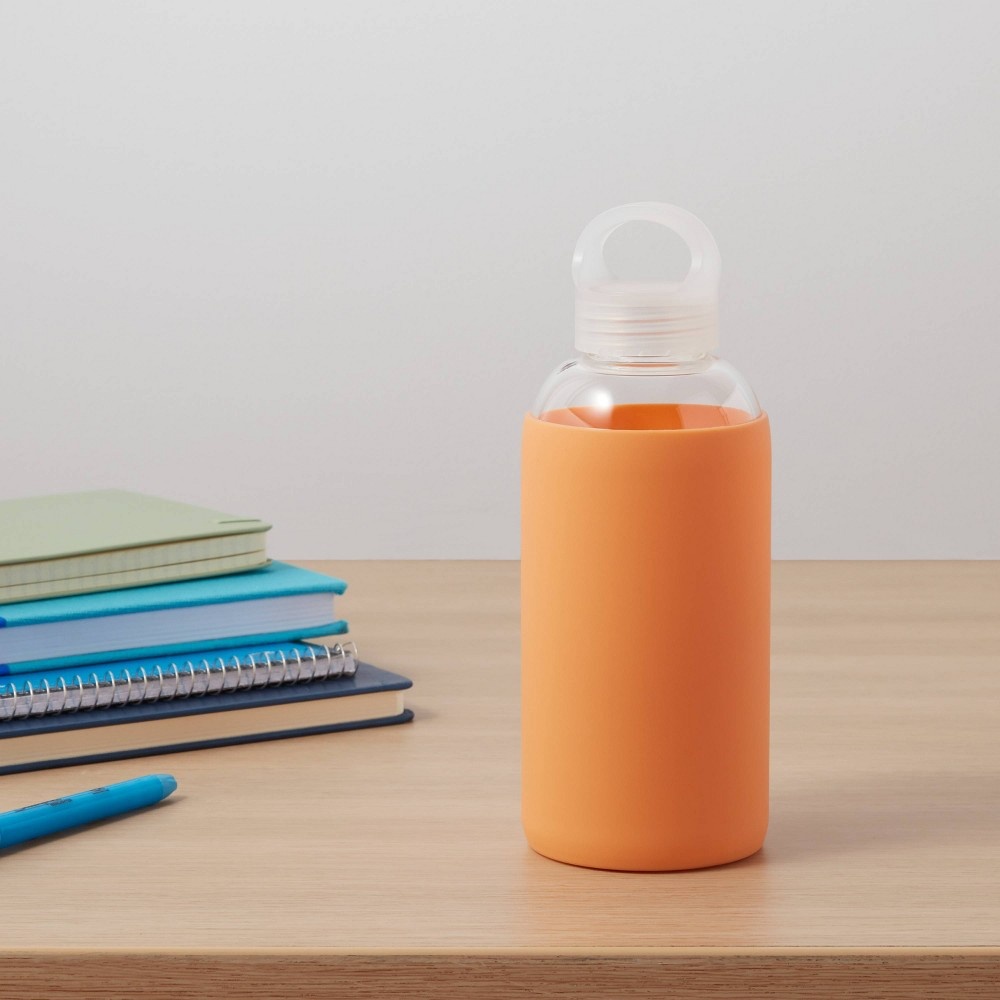 slide 2 of 3, 18oz Borosilicate Glass Water Bottle with PP Lid and Silicone Sleeve Sun Orange - Room Essentials, 1 ct