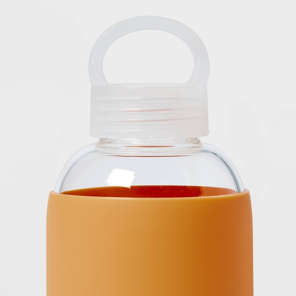 slide 3 of 3, 18oz Borosilicate Glass Water Bottle with PP Lid and Silicone Sleeve Sun Orange - Room Essentials, 1 ct
