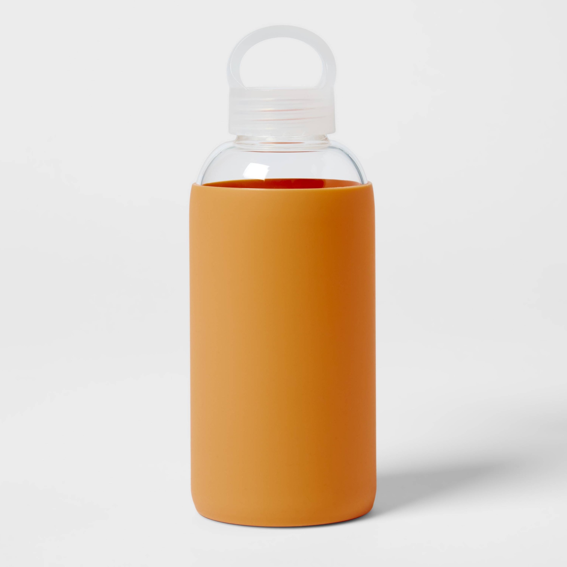 slide 1 of 3, 18oz Borosilicate Glass Water Bottle with PP Lid and Silicone Sleeve Sun Orange - Room Essentials, 1 ct