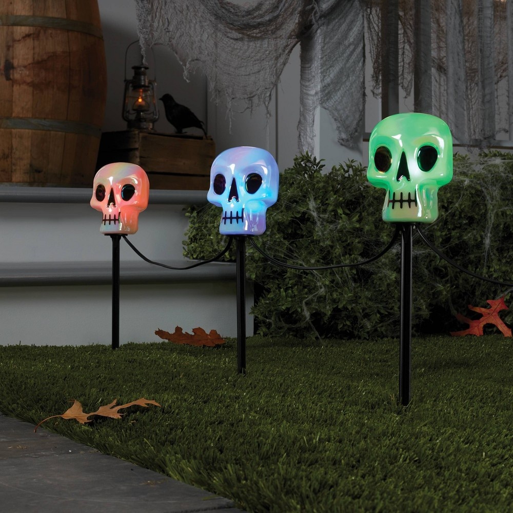 slide 2 of 3, LED Color Changing Iridescent Skull Halloween Novelty Path Lights - Hyde & EEK! Boutique, 5 ct