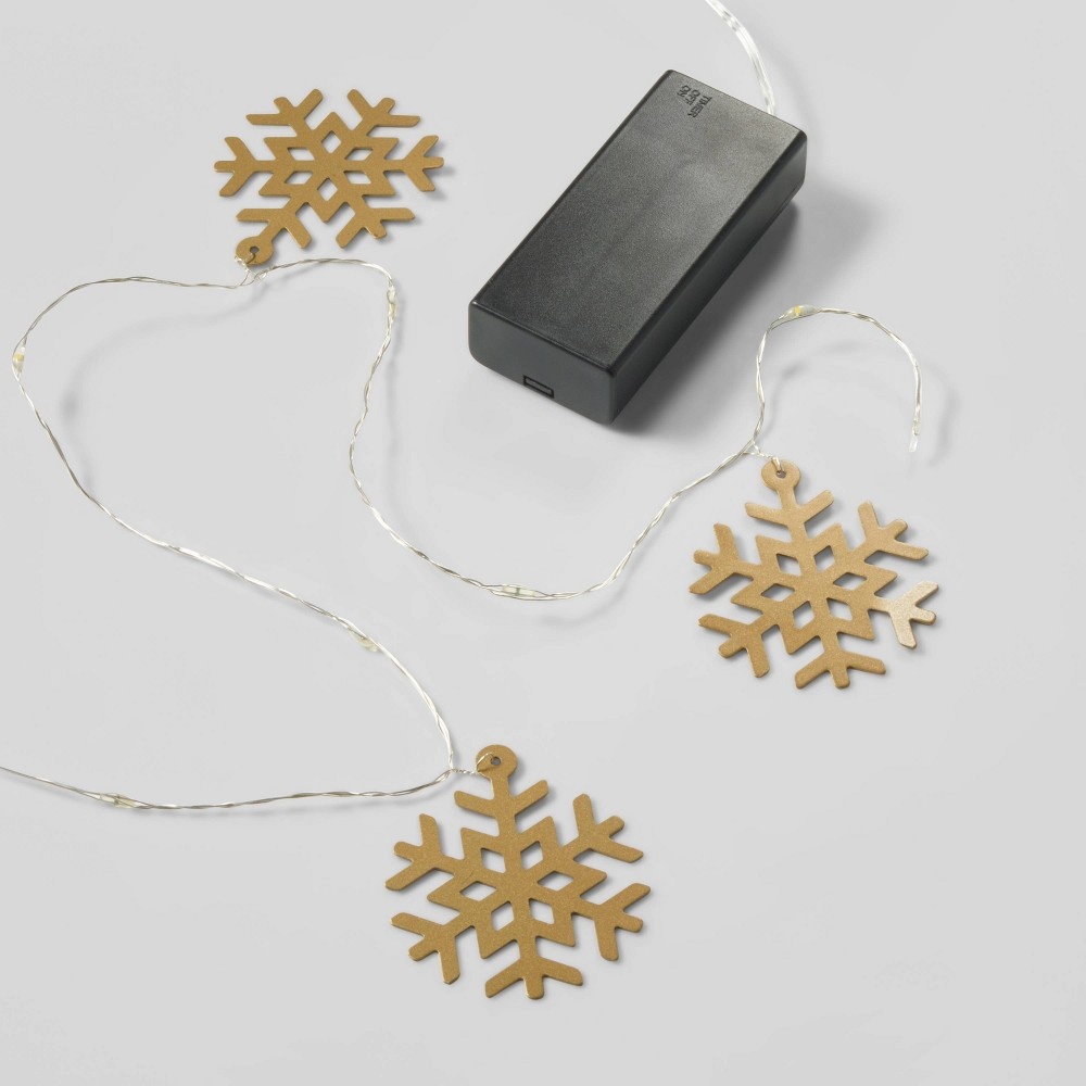 slide 4 of 4, Gold Snowflake Dew Drop Battery Operated LED Christmas String Lights with Timer Warm White with Silver Wire - Wondershop, 30 ct