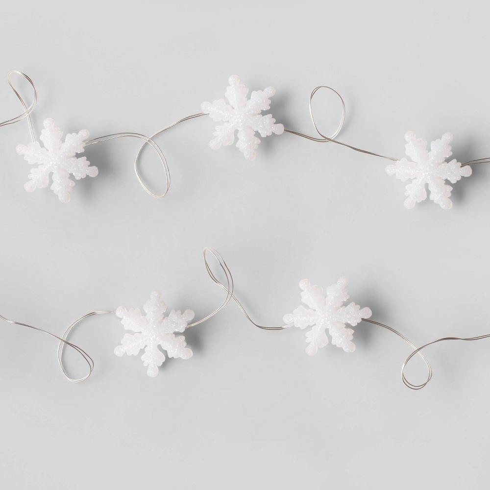 slide 2 of 4, Glitter Snowflake Dew Drop Battery Operated LED Christmas String Lights Warm White with Silver Wire - Wondershop, 30 ct
