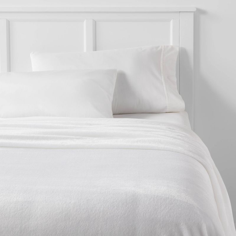 slide 2 of 3, Twin/Twin XL Solid Plush Bed Blanket True White - Room Essentials™: Cozy Lightweight Fleece, Machine Washable, 1 ct