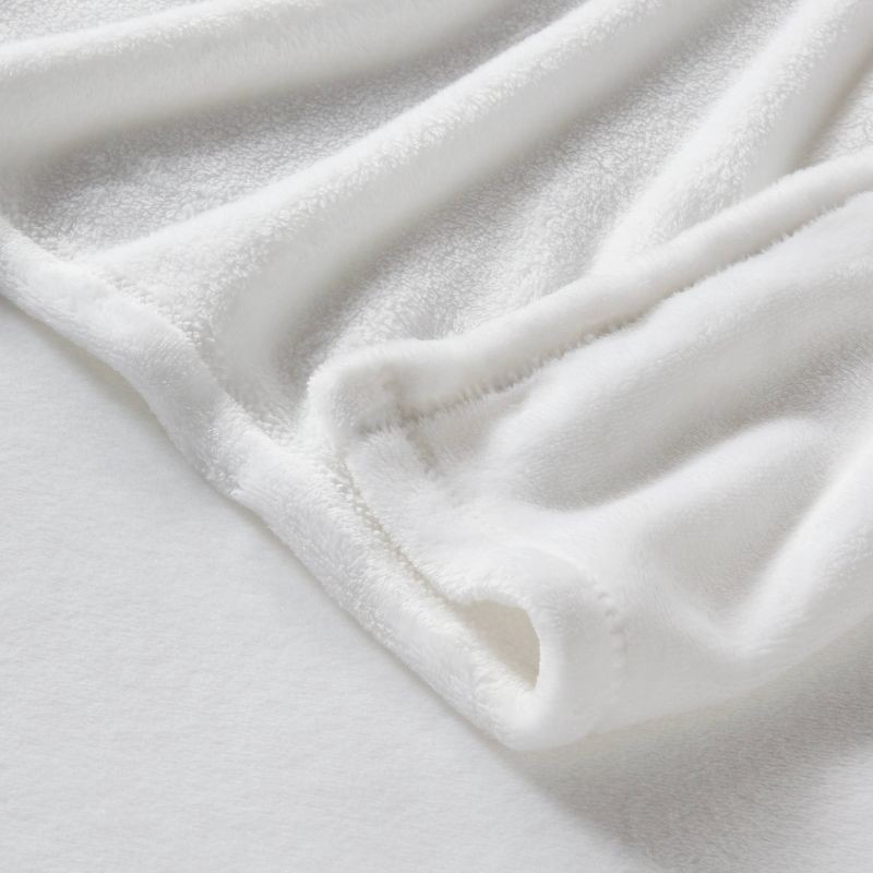 slide 3 of 3, Twin/Twin XL Solid Plush Bed Blanket True White - Room Essentials™: Cozy Lightweight Fleece, Machine Washable, 1 ct