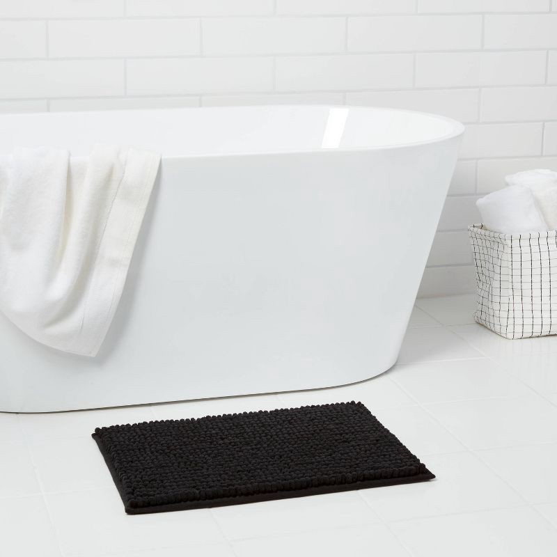 slide 2 of 6, 17"x24" Chunky Chenille Cushion Foam Bath Rug Black - Room Essentials™, 1 ct
