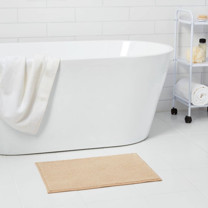 slide 2 of 6, 17"x24" Everyday Chenille Bath Rug Tan - Room Essentials™: Machine Washable, Tufted Polyester, Low Pile, Non-Slip Backing, 1 ct