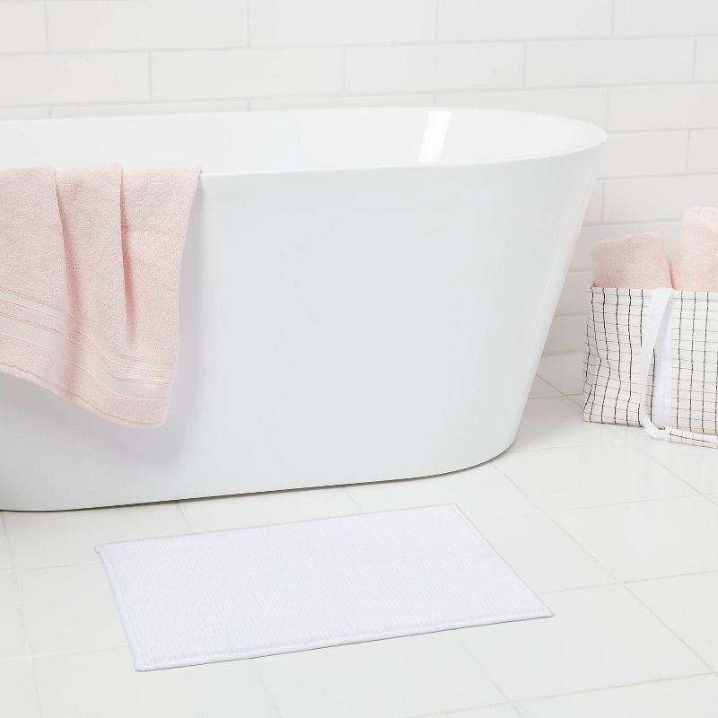 slide 2 of 7, 17"x24" Everyday Chenille Bath Rug White - Room Essentials™, 1 ct