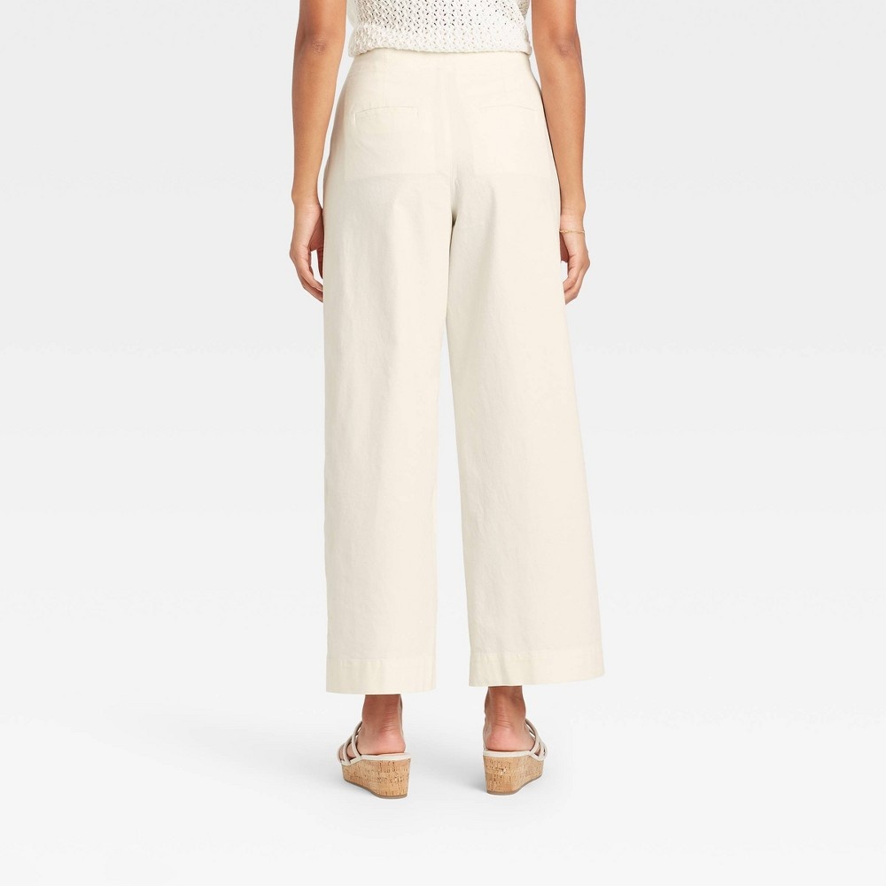 slide 2 of 3, Women's High-Rise Pleat Front Wide Leg Trousers - A New Day Cream 2, 1 ct
