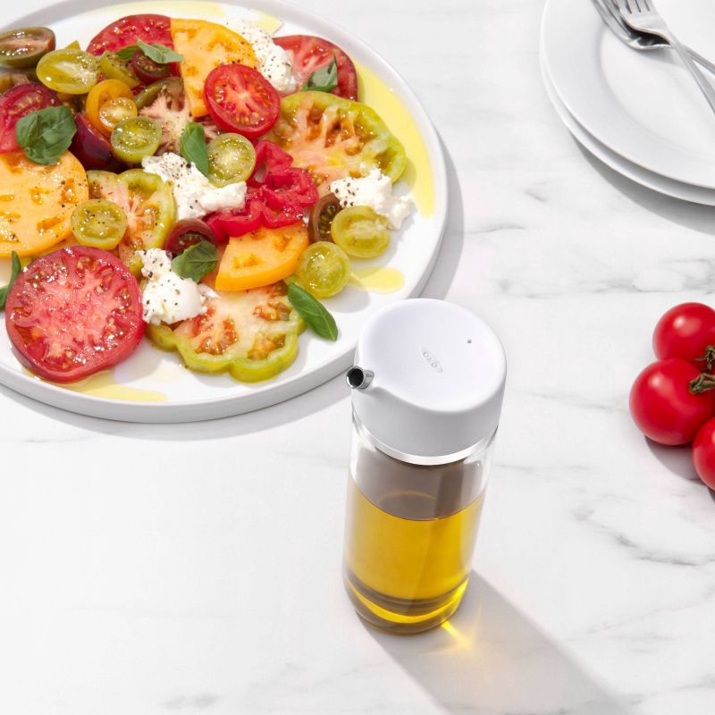 slide 9 of 10, OXO Precision Pour Oil Dispenser: Borosilicate Glass Oil Bottle, 12 oz Capacity, Dishwasher-Safe, White, 12 oz
