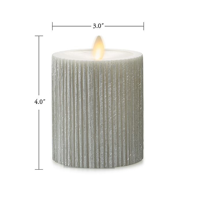 slide 2 of 3, Luminara Moving Flame Champagne Ribbed Real-Flame Effect Pillar Candle, 4.5 in