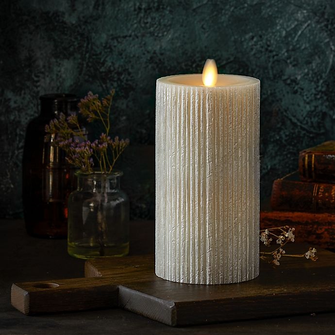 slide 3 of 3, Luminara Moving Flame Champagne Ribbed Real-Flame Effect Pillar Candle, 6.5 in