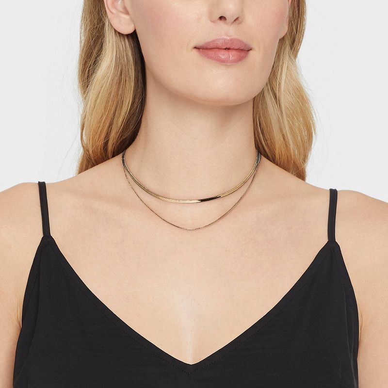 slide 2 of 3, 14K Gold Plated Duo Herringbone Chain Necklace Set 2pc - A New Day™: Nickel-Free, Lobster Claw Clasp, 2 ct