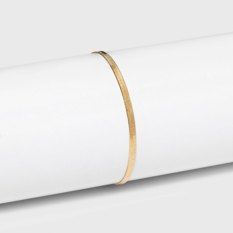 slide 1 of 9, 14K Gold Plated Herringbone Chain Bracelet - A New Day™: Lobster Claw Clasp, 7" Length, Gift Box Included, 14K Gold Over Brass, 1 ct