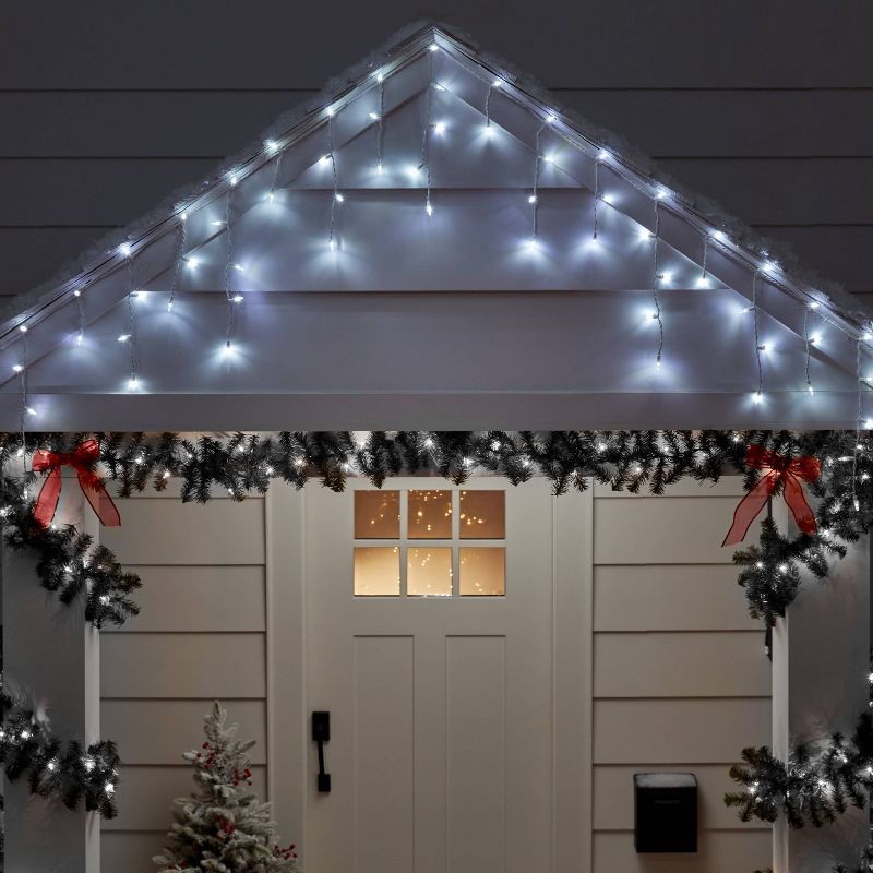 slide 2 of 5, 70ct LED Christmas Icicle Lights Cool White with White Wire - Wondershop™, 70 ct