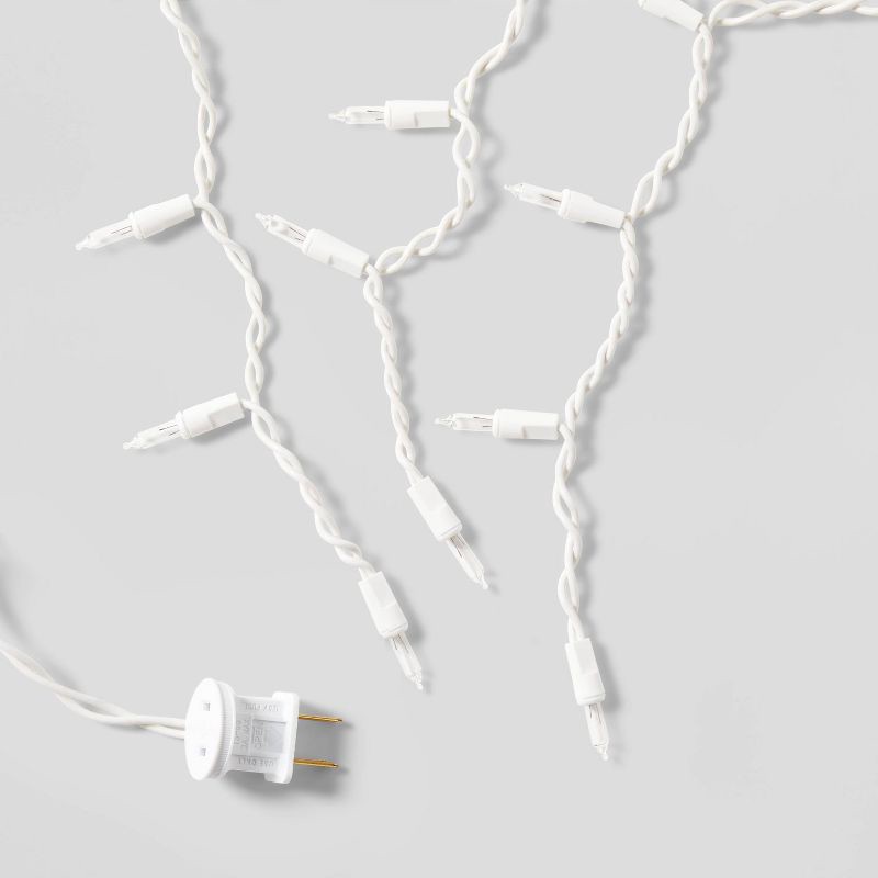 slide 5 of 5, 70ct LED Christmas Icicle Lights Cool White with White Wire - Wondershop™, 70 ct
