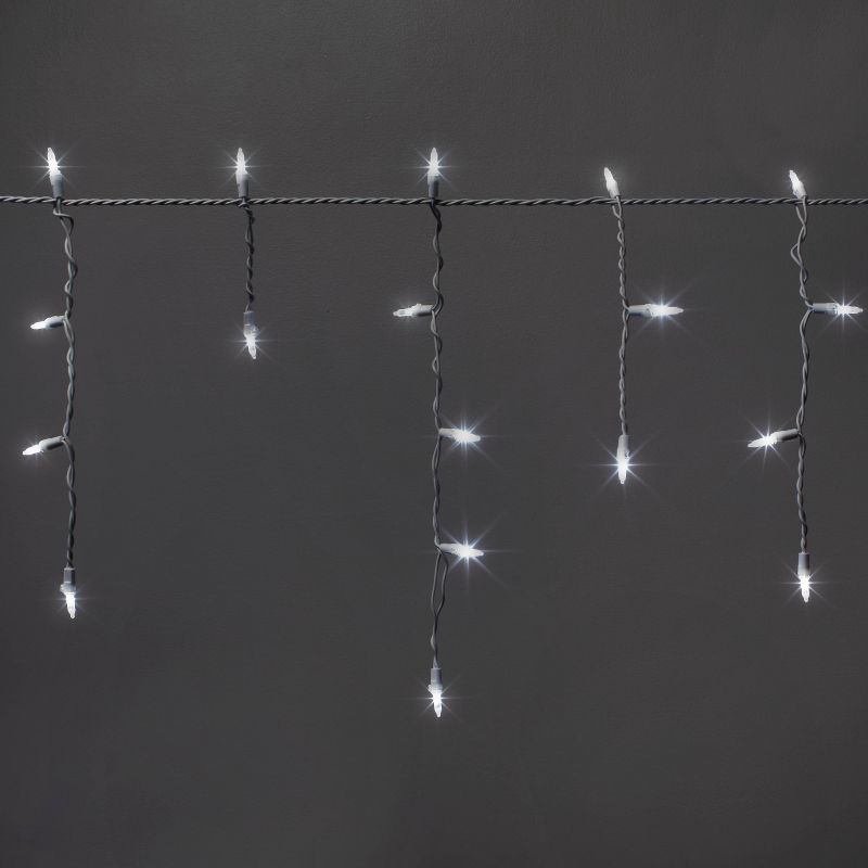 slide 1 of 5, 70ct LED Christmas Icicle Lights Cool White with White Wire - Wondershop™, 70 ct