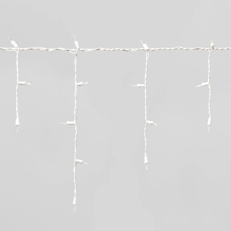 slide 3 of 5, 70ct LED Christmas Icicle Lights Warm White with White Wire - Wondershop™, 70 ct