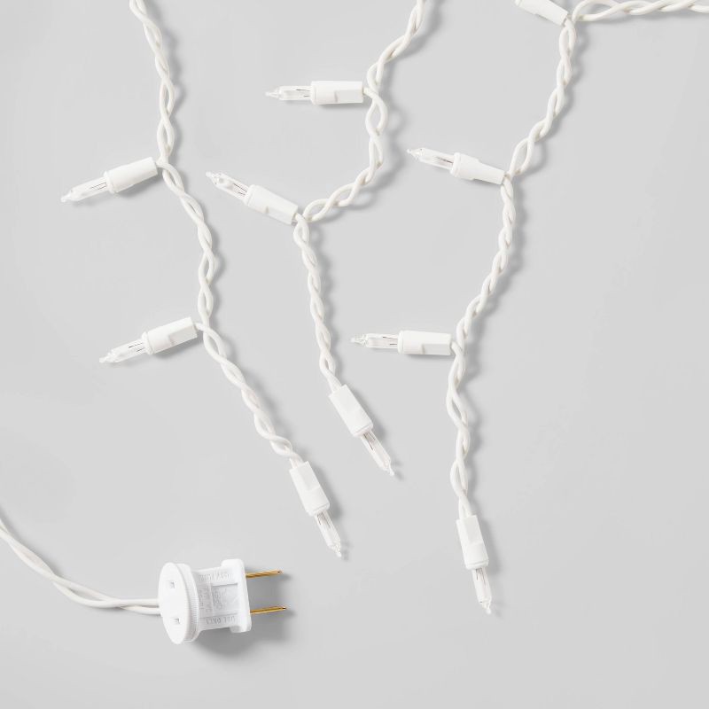 slide 5 of 5, 70ct LED Christmas Icicle Lights Warm White with White Wire - Wondershop™, 70 ct