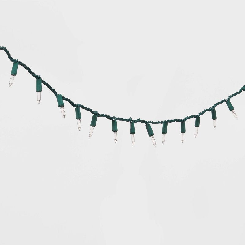 slide 3 of 5, 100ct Incandescent Smooth Mini Christmas String Lights Clear with Green Wire - Wondershop™, 100 ct