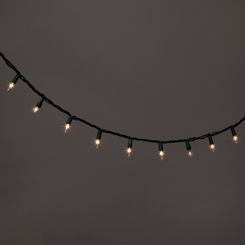 slide 1 of 5, 100ct Incandescent Smooth Mini Christmas String Lights Clear Twinkle with Green Wire - Wondershop™, 100 ct