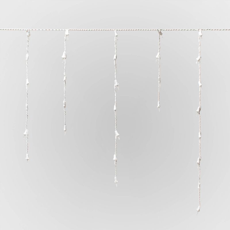 slide 3 of 5, 175ct Christmas Warm White LED Icicle Lights with White Wire and Spool - Wondershop™, 175 ct