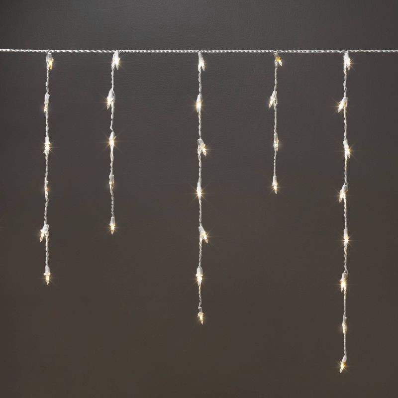 slide 1 of 5, 175ct Christmas Warm White LED Icicle Lights with White Wire and Spool - Wondershop™, 175 ct