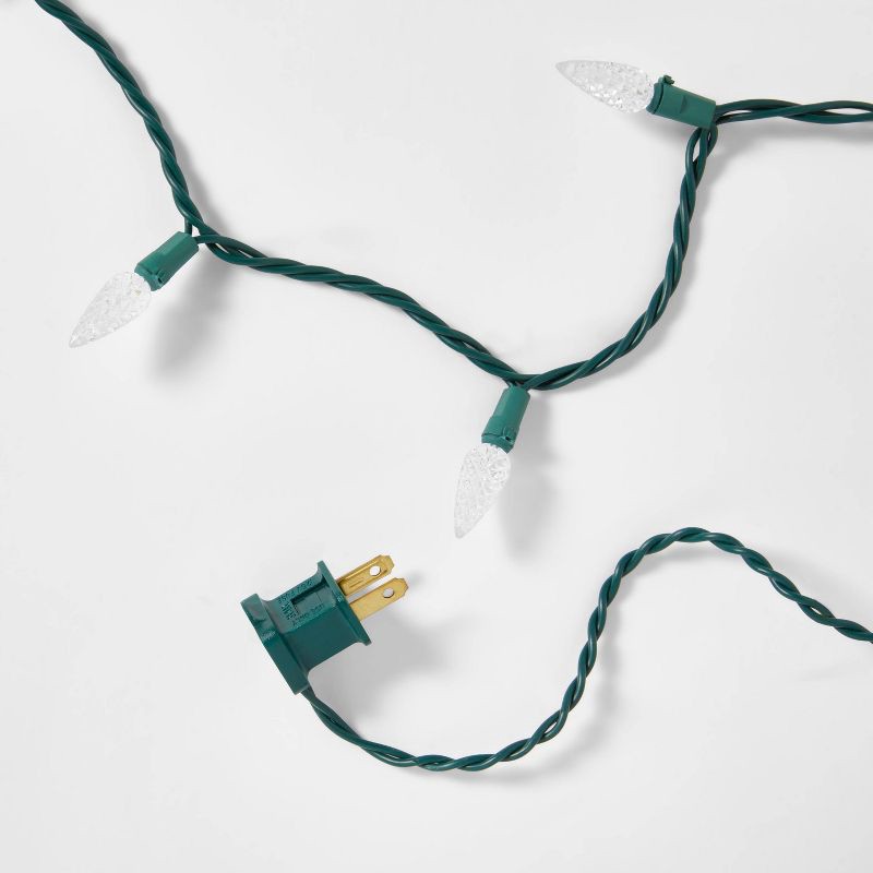 slide 5 of 5, 60ct LED C6 Faceted Christmas String Lights Warm White with Green Wire - Wondershop™, 60 ct