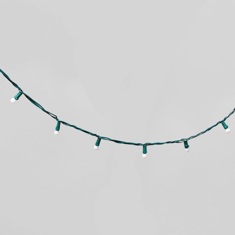 slide 3 of 5, 50ct LED Smooth Sphere Christmas String Lights Warm White with Green Wire - Wondershop™, 50 ct