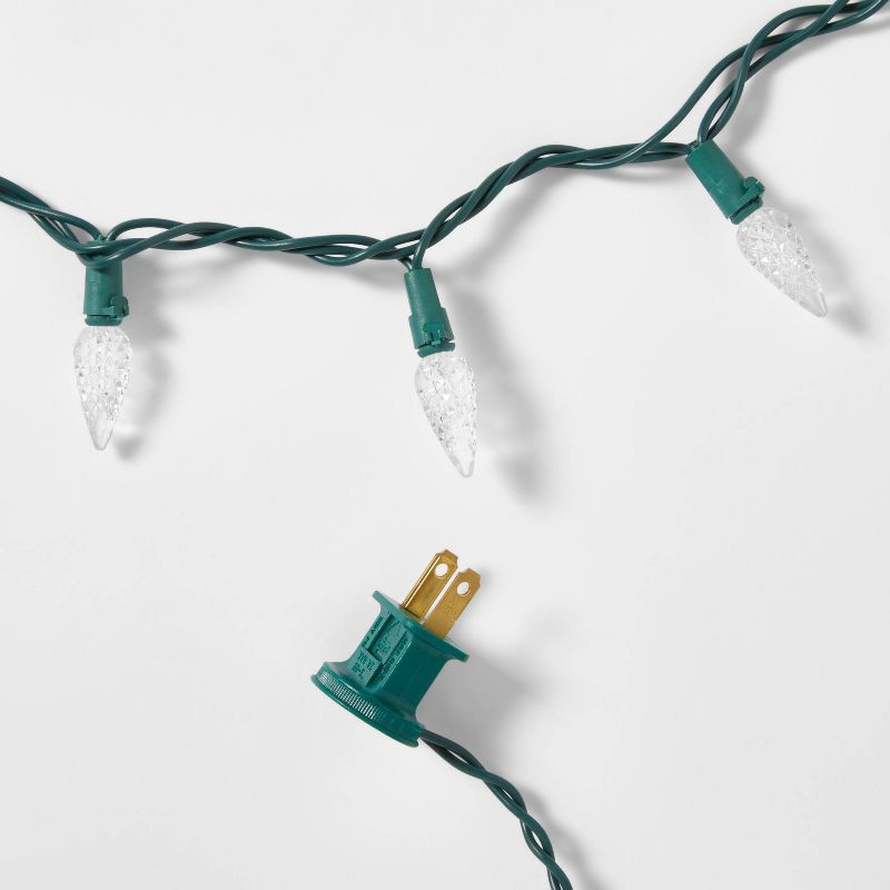 slide 5 of 5, 60ct LED C6 Faceted Christmas String Lights Cool White with Green Wire - Wondershop™: Indoor/Outdoor, UL Listed, Connectable, 60 ct