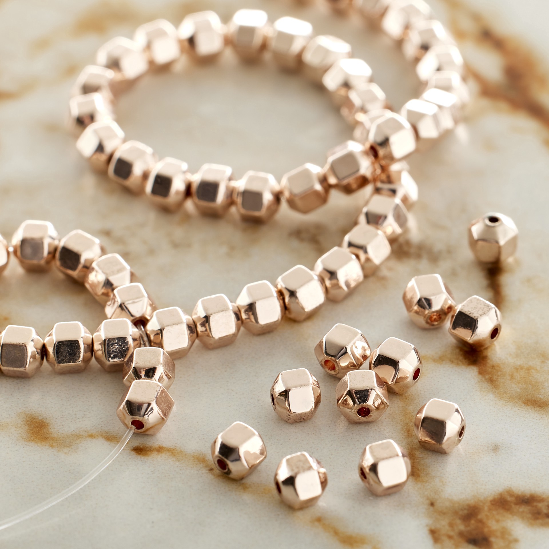 slide 5 of 5, Rose Gold Hematite Bicone Beads, 4mm By Bead Landing, 4 mm