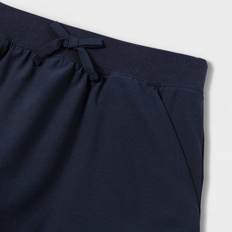 slide 3 of 3, Girls' Woven Performance Uniform Skort - Cat & Jack™ Blue S: Recycled Polyester, Spandex, Built-in Shorts, Elastic Waistband, 1 ct