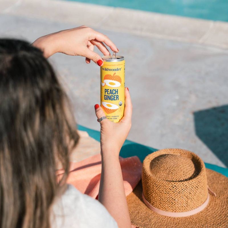 slide 4 of 5, wildwonder Peach Ginger Organic Prebiotic + Probiotic Sparkling Drink - 12 fl oz Can, 12 fl oz