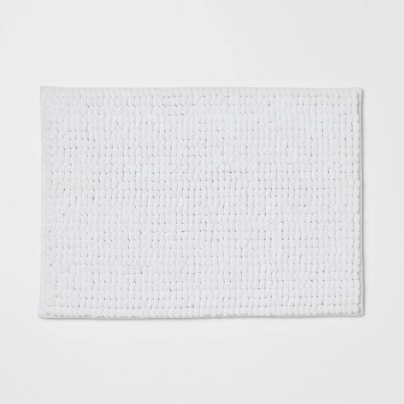 slide 1 of 4, 17"x24" Chunky Chenille Cushion Foam Bath Rug White - Room Essentials™, 1 ct
