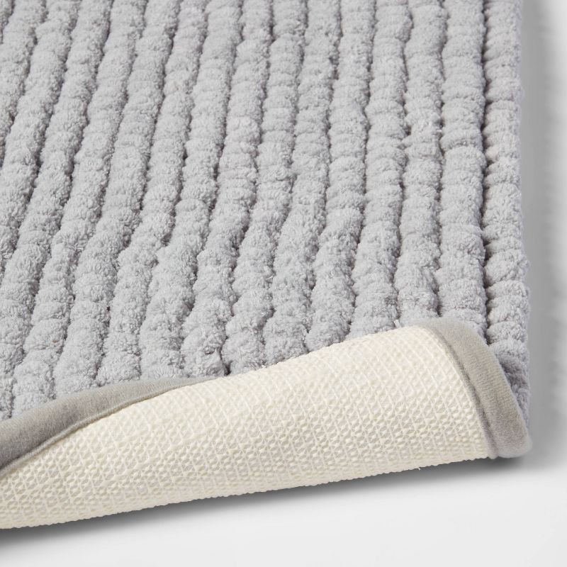 slide 4 of 4, 17"x24" Chunky Chenille Cushion Foam Bath Rug Light Gray - Room Essentials™, 1 ct