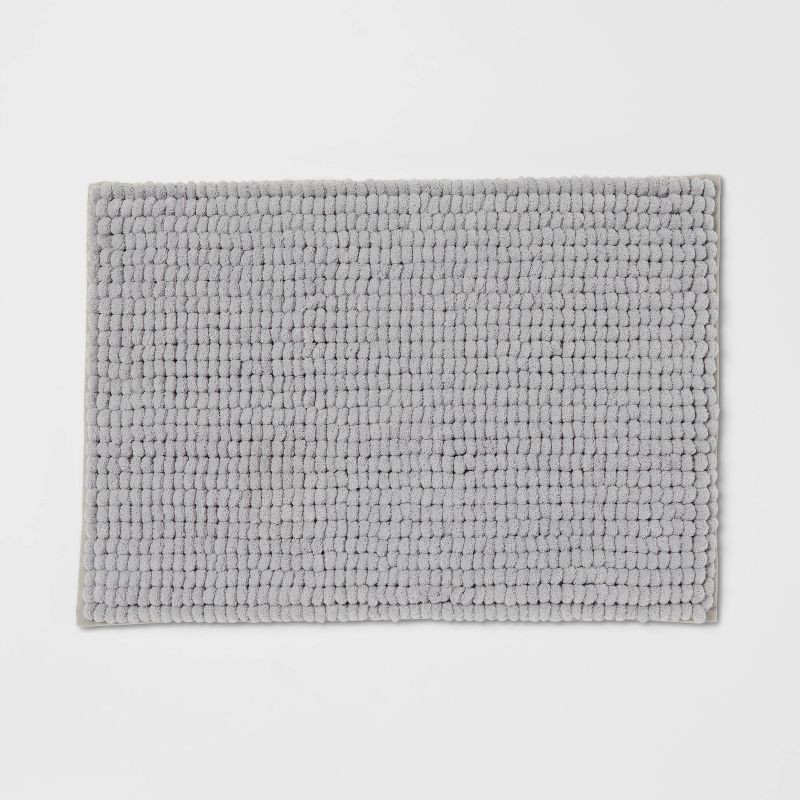 slide 1 of 4, 17"x24" Chunky Chenille Cushion Foam Bath Rug Light Gray - Room Essentials™, 1 ct