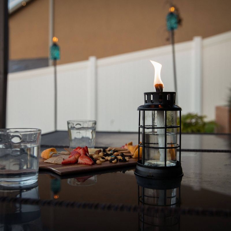slide 3 of 7, TIKI Table Top Round Lantern: Outdoor Glass Oil Lamp, Fiberglass Wick, No Assembly Required, 1 ct