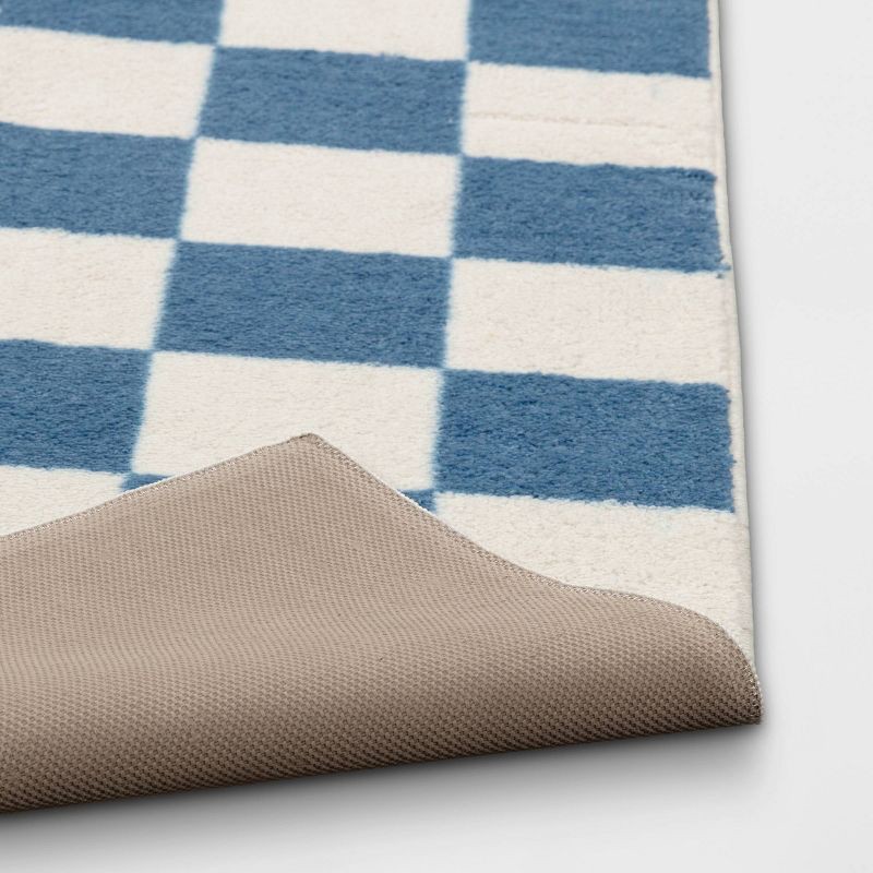 slide 4 of 4, 4'x5'5" Area Kids' Rug Checker Blue - Pillowfort™, 1 ct
