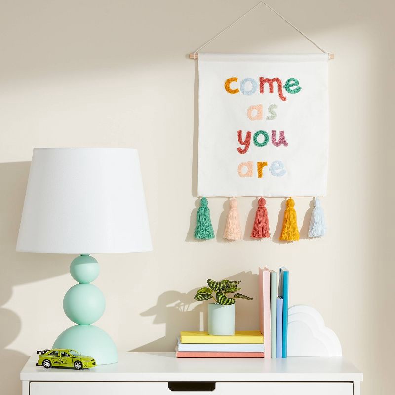 slide 2 of 3, 10oz 'Come as you are' Kids' Wall Decor with Tassels - Pillowfort™, 10 oz