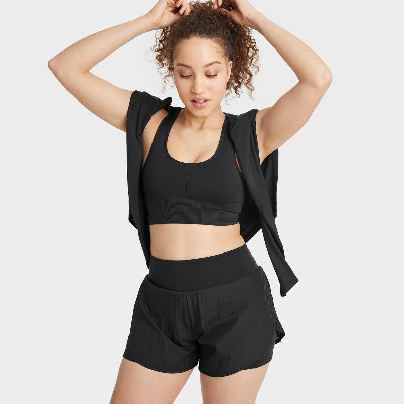 slide 7 of 7, Women's Seamless Medium Support Racerback Sports Bra - All In Motion™ Black L: Removable Padding, Knit, 1 ct