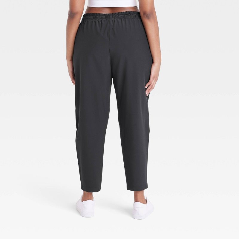 Women's Stretch Woven Taper Pants - All in Motion Black XL 1 ct