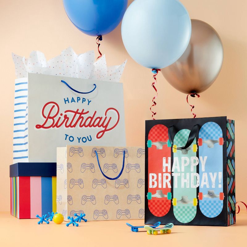 slide 2 of 3, Game Controllers on Kraft Medium Birthday Gift Bag Brown/Blue - Spritz™, 1 ct