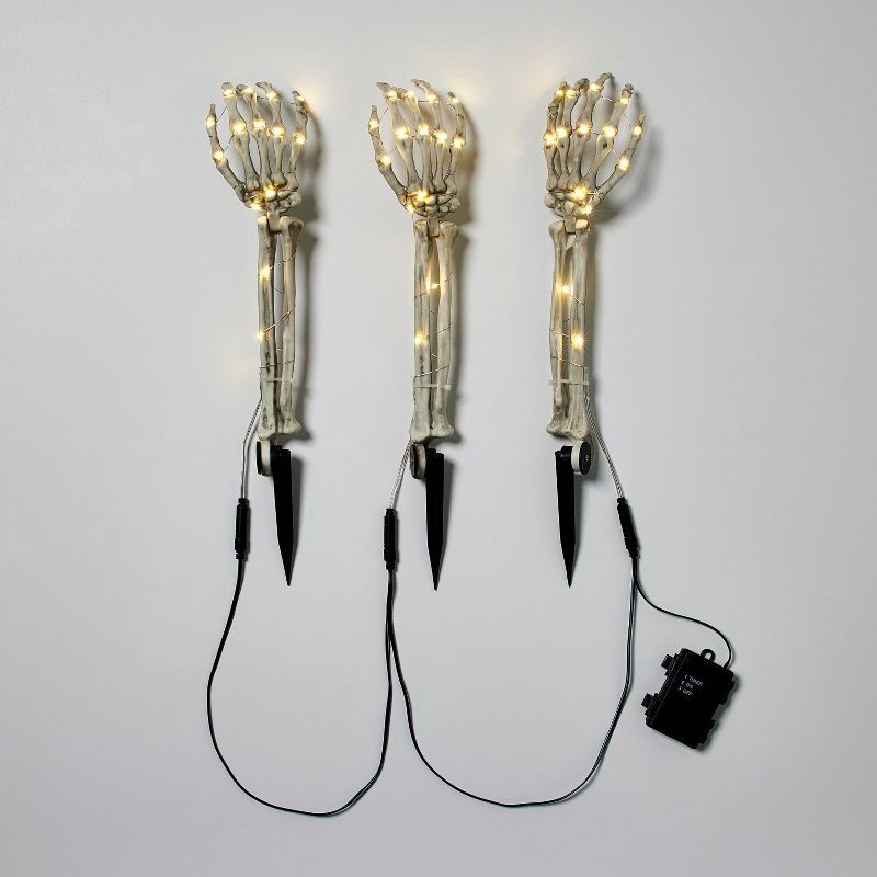 slide 1 of 5, 3ct LED Skeleton Arms Halloween Novelty Path Lights with Timer - Hyde and EEK! Boutique™, 3 ct