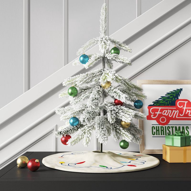 slide 2 of 3, 19" Unlit Flocked Indexed Downswept Pine Artificial Christmas Tree with Round Base - Wondershop™, 1 ct