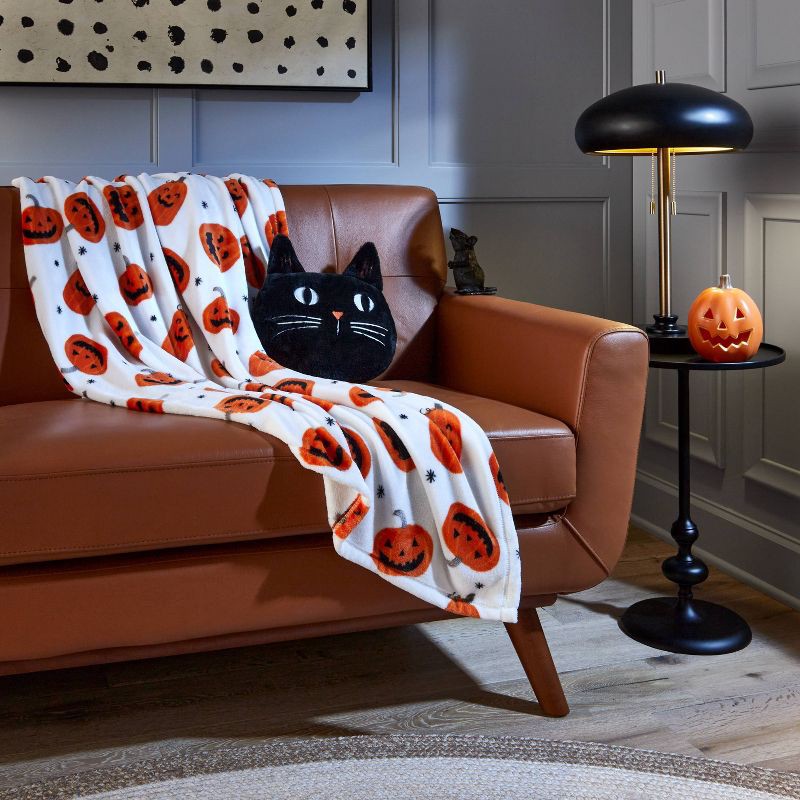slide 2 of 4, Tossed Small Jack-O-Lanterns Halloween Throw Blanket - Hyde & EEK! Boutique, 1 ct